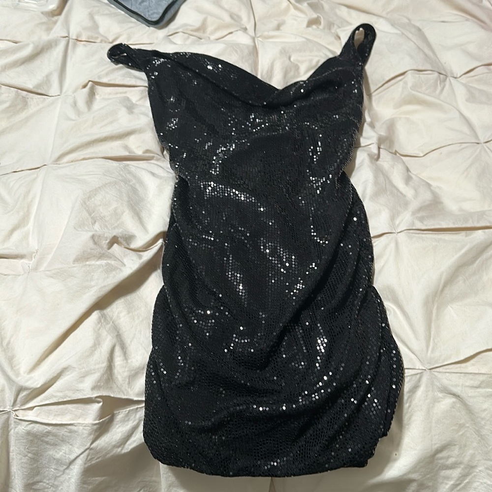 Black sequins dress never worn.